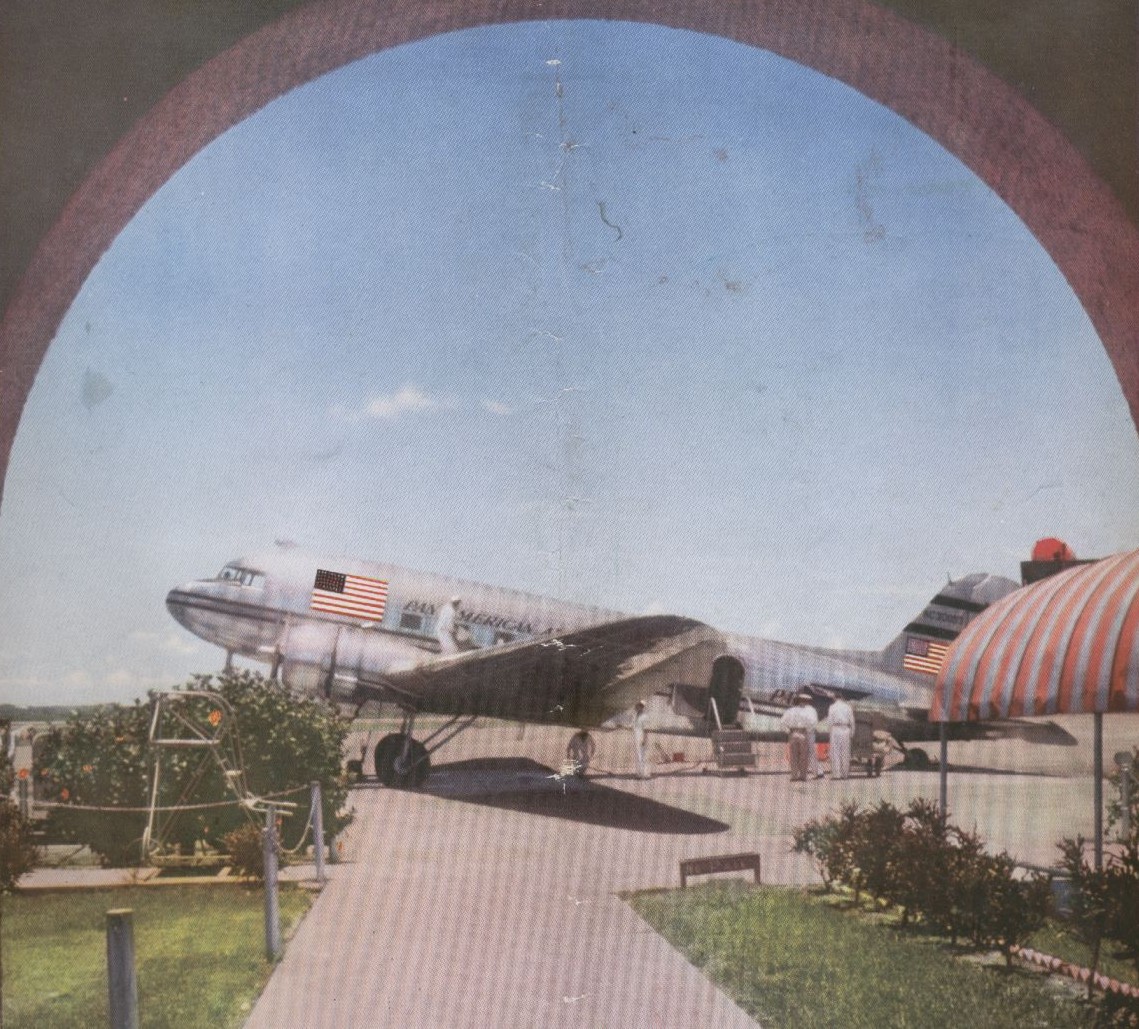 A Pan Am DC 3 as seen from an airport terminal archway.
